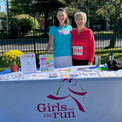 Volunteers at a GOTR info table